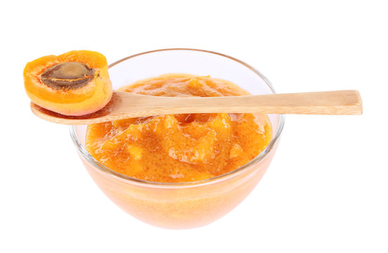 tasty apricot jam with fresh apricot, isolated on white