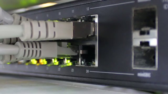 Modern network switch with cables and connectors.