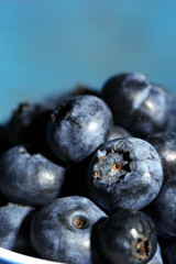 Tasty ripe blueberries, on wooden background