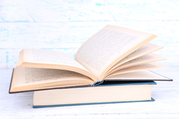 Books on light wooden background