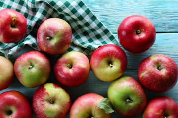 Juicy apples on wooden table, close-up