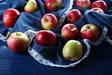 Juicy apples on wooden table, close-up