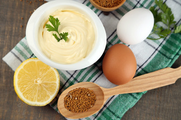 Mayonnaise ingredients on wooden background