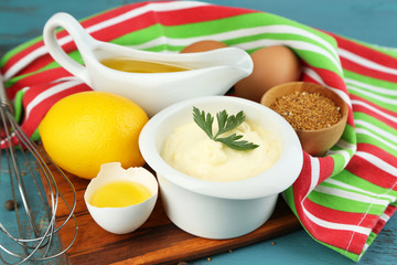 Mayonnaise ingredients on wooden background