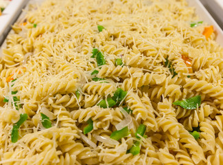 closeup macaroni pasta in buffet tray