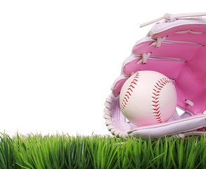 Baseball in Pink Female Glove on Green Grass, isolated on white.