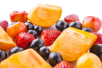 Strawberry, persimmon, and cherries with white background.
