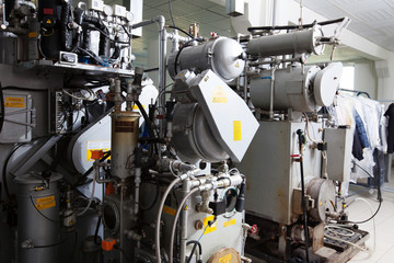 Dry cleaning equipment on clothes background