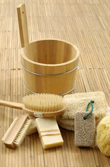 Fototapeta na wymiar bath accessories on the bamboo mat