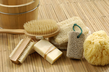 Obraz na płótnie Canvas bath accessories on the bamboo mat