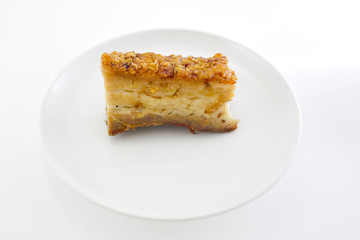 Freshly baked crispy pork belly on white background