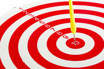 One darts in center of target isolated on white