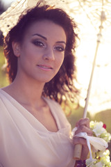 Photos in retro style - beautiful girl with an umbrella