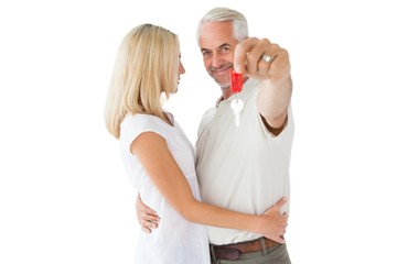 Happy couple showing their new house key