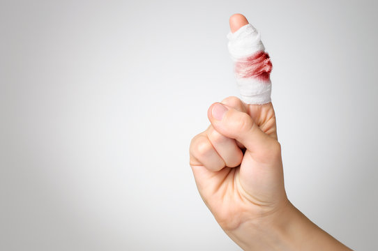 Injured Finger With Bloody Bandage