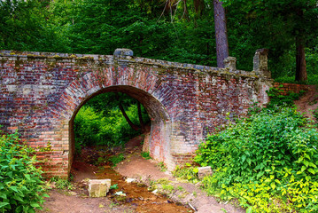 old stone bridge in the woods