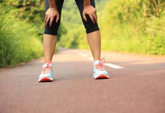 Tired Woman Runner Taking A Rest After Running  