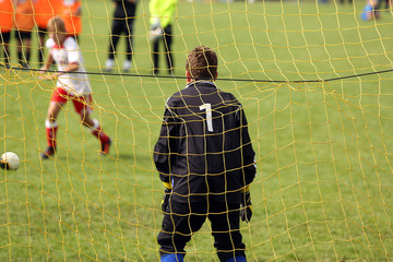 Young boys play football match and doing penalty kick