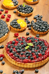 Fruit tart dessert with raspberries blackberries and cranberries
