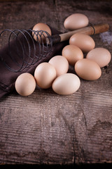 Chicken eggs on wooden background