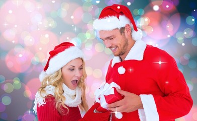 Composite image of young festive couple