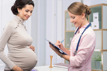 Doctor with patient pregnant woman
