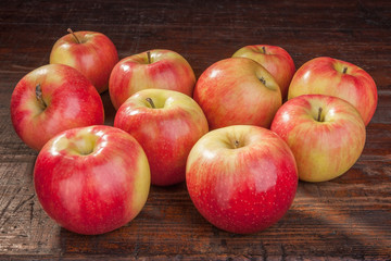 red apples on the old table