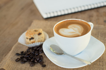 Cappuccino or latte coffee with heart shape