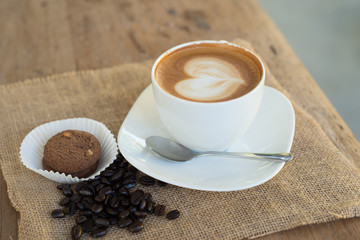 Cappuccino or latte coffee with heart shape