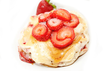 Pancakes Covered with Fresh Strawberries and Syrup
