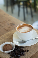 Cappuccino or latte coffee with heart shape