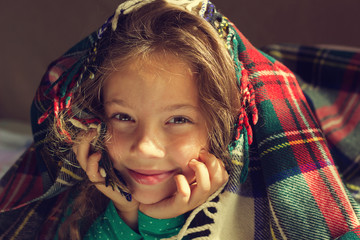 Vintage Portrait of cute smiling girl look out from plaid