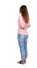 back view of standing young beautiful  redhead woman.