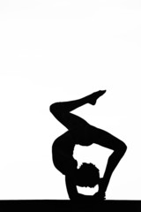 Fototapeta na wymiar women contortionist practicing gymnastic yoga in silhouette
