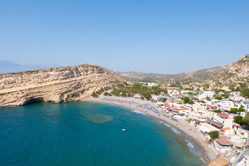 Matala sandy beach with caves near Heraklion town. Crete, Greece