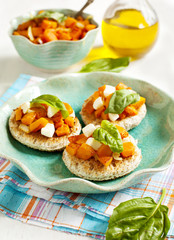 Pumpkin bruschetta. Bruschetta with roasted pumpkin, cheese and basil