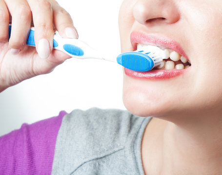 Girl Brushing Her Teeth