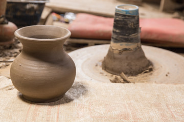 Fototapeta na wymiar Handmade pottery on shelf in factory,still life