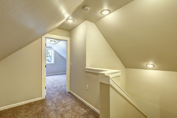 Fototapeta na wymiar Upstairs hallway with vaulted ceiling