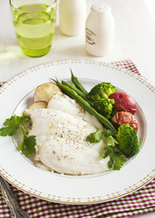 Baked fish fillet served with broccoli, green bean and potato