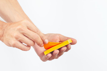 Hand with orange stickers on a white background