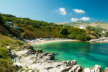 Kassiopi Beach, Corfu Island, Greece. Sunbeds and umbrellas