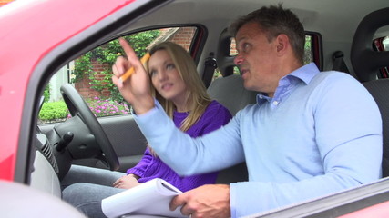 Teenage Girl Having Driving Lesson With Instructor