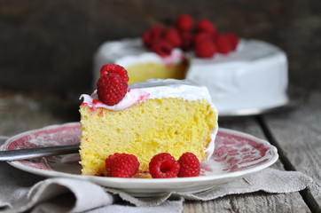 Cake tres leches with meringue frosting and raspberries