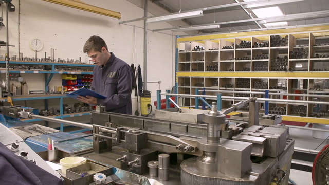 Time Lapse Sequence Of Factory Engineer Operating Equipment