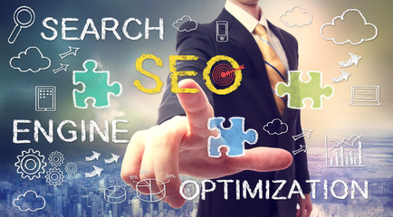 Businessman pointing SEO (search engine optimization)