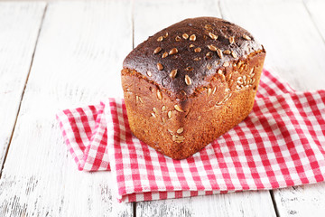 Fresh bread on wooden table, close up