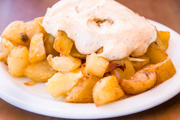 typical spanish patatas bravas, spicy potatoes