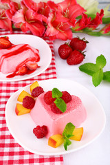 Cakes with fruit and berries on plate on napkin