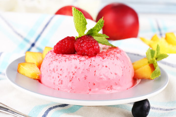 Heart shaped cake with fruits and berries on plate on